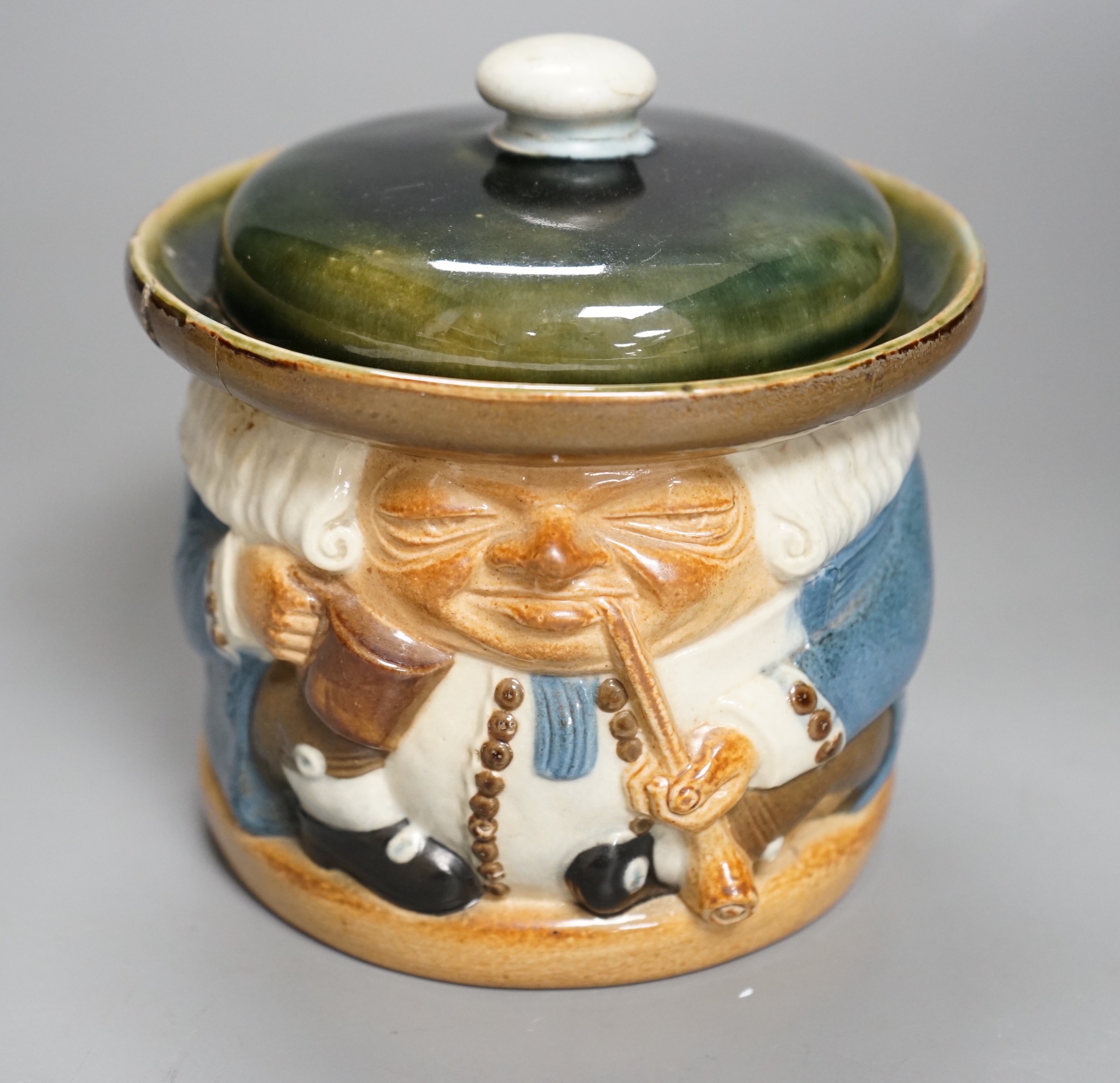 A Doulton Lambeth tobacco jar by Harry Simeon, 13cm